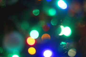 Colorful Christmas bokeh lights. Defocused Christmas background.