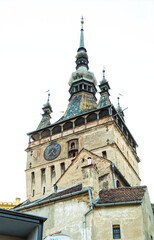 Fototapeta premium Medieval tower with a clock and a bell. Citadel of Sighisoara, Romania