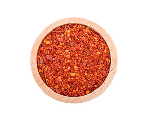 pile crushed red cayenne pepper, dried chili flakes and seeds on white background.