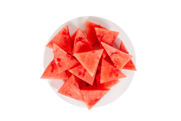 Lots of small triangular slices of ripe red watermelon on a plate. Isolated on white background. View from above