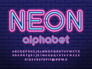 Glowing neon light alphabet design with uppercase, lowercase, numbers and symbol © FotoGraphic