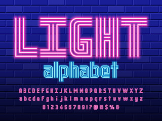 Glowing neon light alphabet design with uppercase, lowercase, numbers and symbol