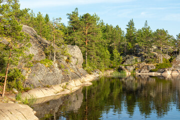 Obraz premium beautiful landscape with natural green plants and trees, rocks, mountain and pond, river in Karelia, Russia