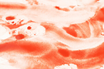 blood on a white surface in the background, closeup