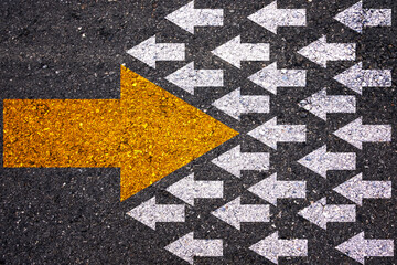 Different thinking and Business and technology disruption concept. Yellow big arrow opposite  direction with white arrow on road asphalt. - obrazy, fototapety, plakaty