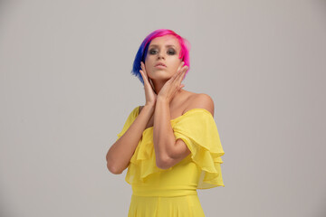 beautiful femail model wearing yellow dress with colour hair