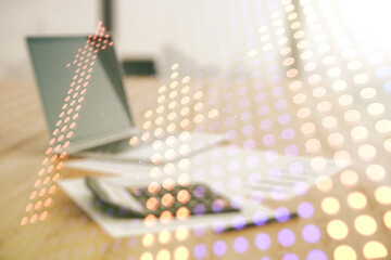 Virtual upward arrows hologram on blurry calculator and computer background, leadership and motivation concept. Multiexposure