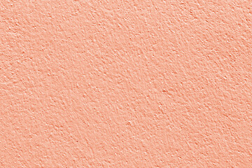 Rose gold color concrete wall texture for background and design.