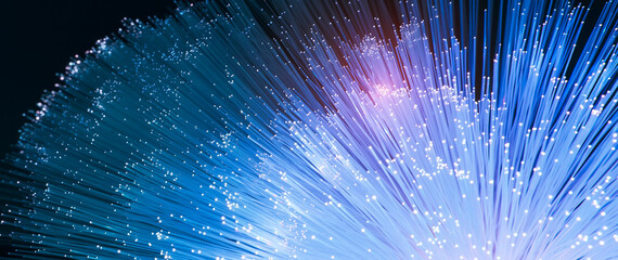 Fiber optics network cable on technology background