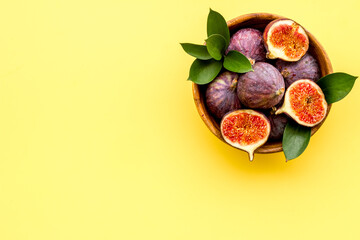 Fresh figs with green leaf. Mediterranean fruit background