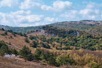 Fototapeta na wymiar Mountain landscape of the southern Crimea. Walking along the high-mountainous plateau Ai Petri.