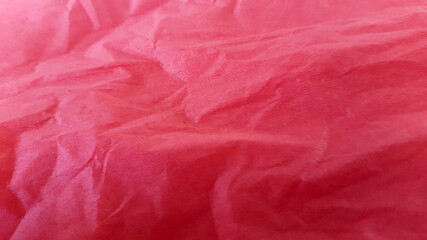 Fototapeta premium Crumpled red paper. Creative vintage background