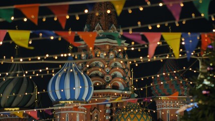 St. Basil's Cathedral on Red Square against the backdrop of Christmas decorations.