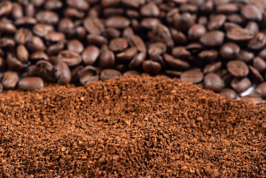 Coffee Beans And Grounds Background.Roasted Coffee Beans And Grounds Close Up From Above Selective Focused.