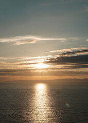 sunset over the ocean in the evening from the mountain