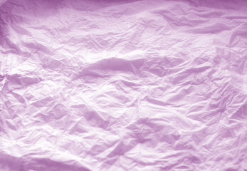 Crumpled paper background in purple.