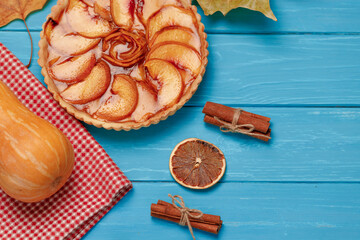 Apple tart pie on blue wooden background