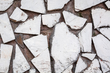 White painted stone wall. The background.