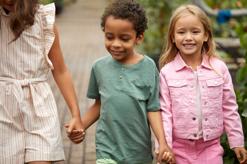 diverse kindergarten children get to know the world around them, the greenhouse is a great place for an excursion, look, learn