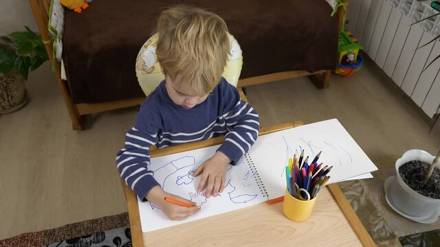 Little Boy Learns Drawing with Felt-tip pen. Child Education at Home. Creative Preschooler Study. 2x Slow motion 60 fps 4K