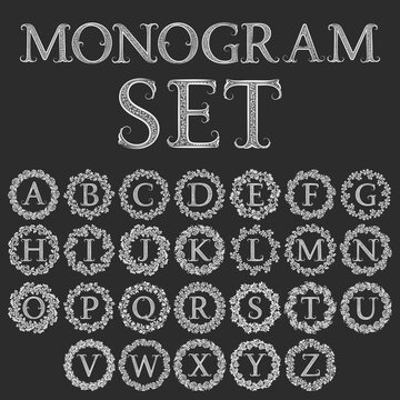 Set of monograms in circular floral wreath. Vintage latin alphabet in round floral frames. Isolated letters labels in vintage baroque style.