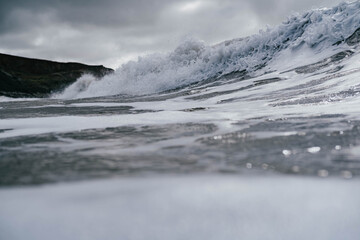 waves crashing into sea 