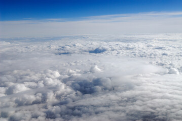 Flying above white puffy clouds