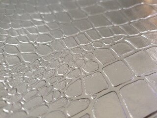 Leather texture on a metal surface.