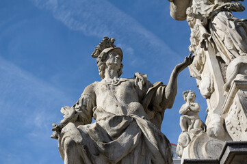 Obraz premium Statue and sculpture of Saint Primitiva, Holy trinity column, Brno, CZech Republic / Czechia - old historical figural landmark and monument. Shallow focus.