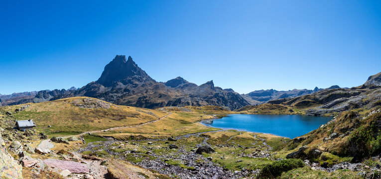 Pic du Midi d'Ossau mountain and Lac Gentau mountain lake in Ossau Valley, iconic symbol of the French Pyrenees, Pyrenees National Park