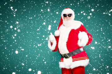 Real funny Santa Claus wearing sunglasses.