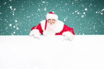 Naklejka na ściany i meble Real Santa Claus showing white empty board.