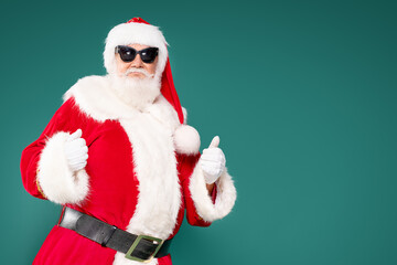 Real funny Santa Claus wearing sunglasses.