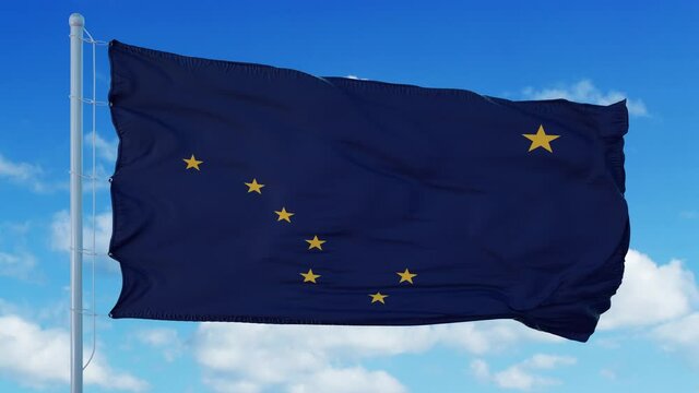 Alaska flag waving in the wind, blue sky background. 4K