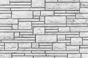 Block pattern of white stone cladding wall tile texture and seamless background