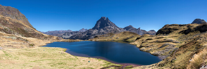 Pic du Midi d'Ossau mountain and Lac Gentau mountain lake in Ossau Valley, iconic symbol of the French Pyrenees, Pyrenees National Park