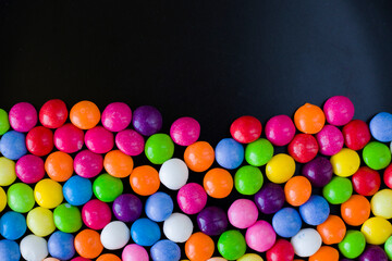 Skittles candy on the table, colorful sweet candy