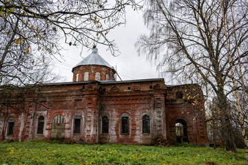 old abandoned red brick building on autumn sad day