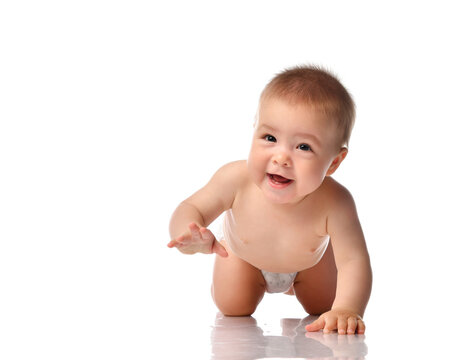 Cute little baby with evil smile crawling on floor