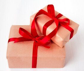Gift boxes tied with red ribbons on a white background, Christmas decoration, gift wrapping
