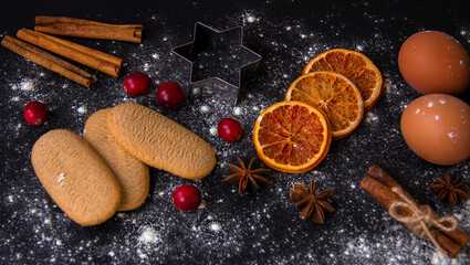 Christmas Baking background. Ingredients for cooking christmas baking on dark stone or metal background. Top view