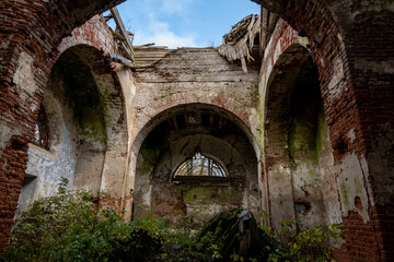 Fototapeta premium old abandoned red brick building on autumn sad day