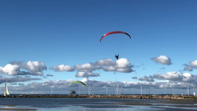 motorized hang glider landing on the beach