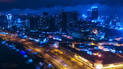 Fototapeta na wymiar Road, lights and sea at night. Luanda city captured from the top