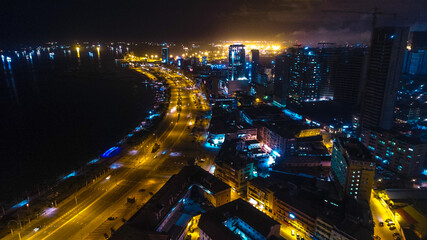 Road, lights and sea at night.
Luanda city captured from the top