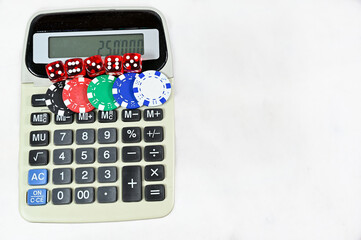 dice and chips on old calculator on white background