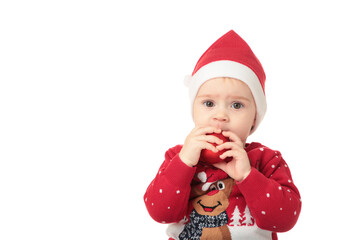 Baby in Santa hat playing with Christmas balls, isolated on white