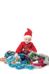 Small girl play with tinsel. Christmas holiday decoration. Happy new year. Happy childhood.