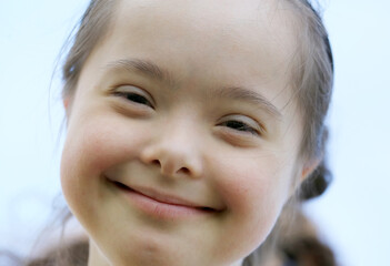 Cute smiling down syndrome girl
