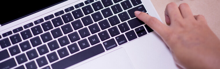 Hand of woman touch keyboard for Online Shopping Payment at the store, Credit Card Concept, Black Friday festival, Order shopping.